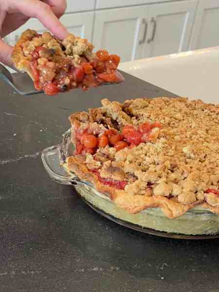 Juicy cherries, a flaky crust, and a buttery Dutch crumb topping—this cherry pie is comfort in every bite.